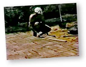 An old photo of Dad making a brick patio at the house the family lived in before I was born.