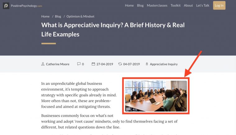 Screen shot of article "What is Appreciative Inquiry? a Brief History and Real Life Examples"  A red box and arrow indicates a photo of a group of happy diverse people sitting in a conference room.