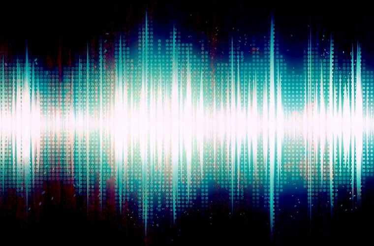 Brightly colored audio sound wave on black background