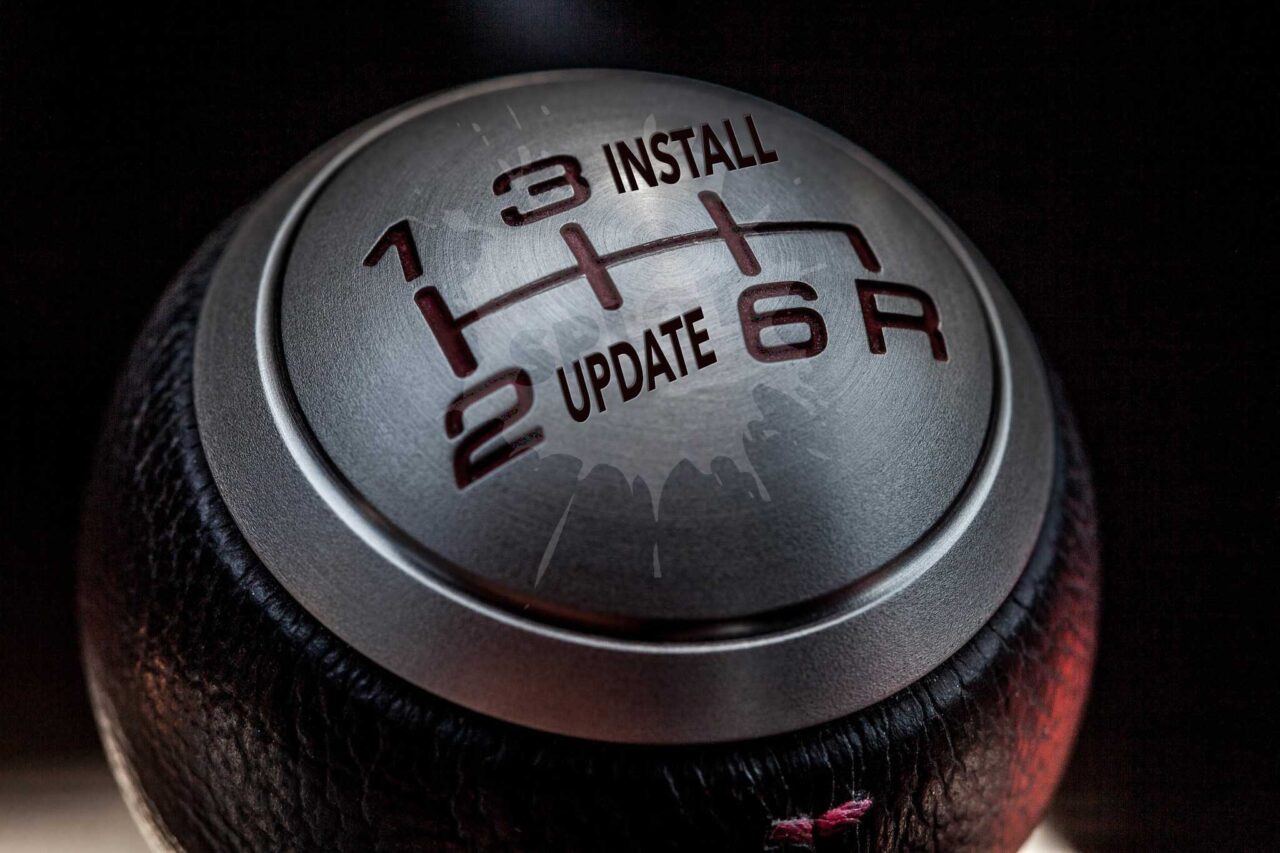 Automobile stick shift with gear 4 replaced by "install" and gear 5 replaced by "update"