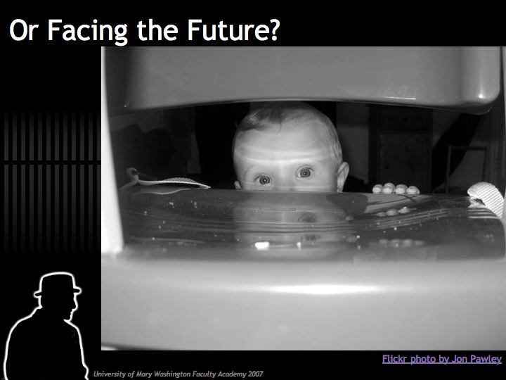 Presentation slide with title "Or Facing the Future" and image of adorable infant perring through back of a metal chair, his eyes wide open.
