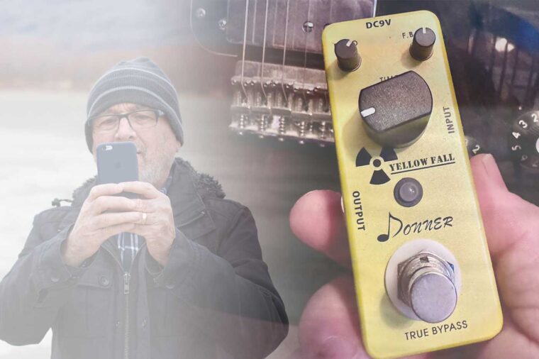 On the left is somewhat faded image of a man in winter ski hat aimng a mobile camera towards the viewer. The image blends on the right to a yellow box with knobs and switches, a n effects pedal, held in front of the bottom part of an electric guitar.