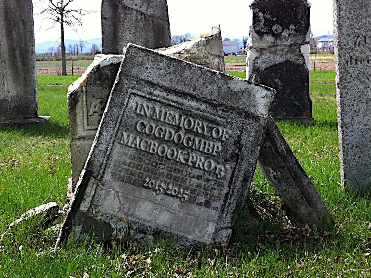 In memory of CogDogMPB Macbook Pro 13" embossed on a tilted old tombstone.