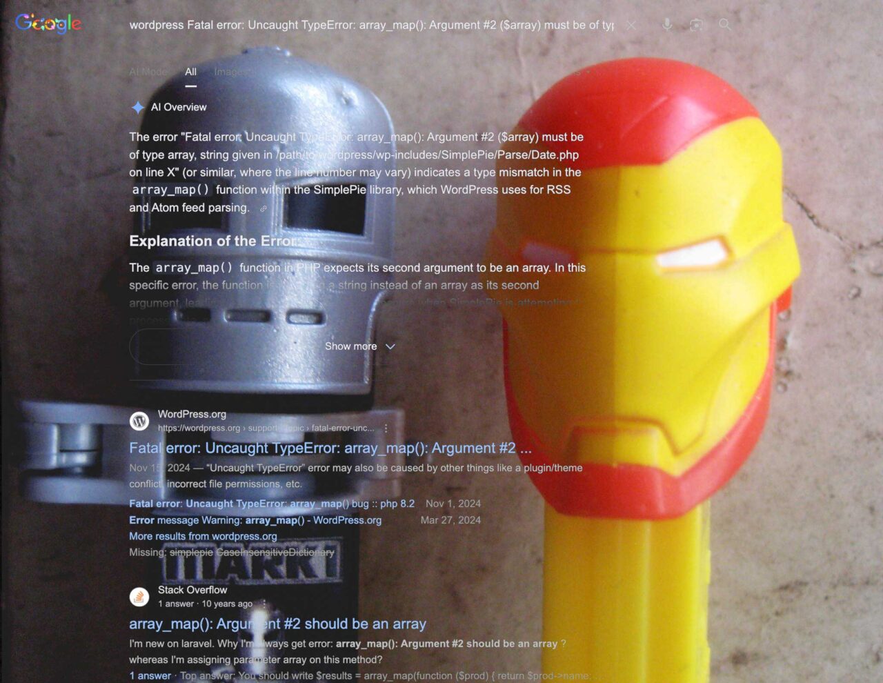 A google result for a search on a WordPress error message superimposed on top of two tpry pez candy dispensers thta look like robots