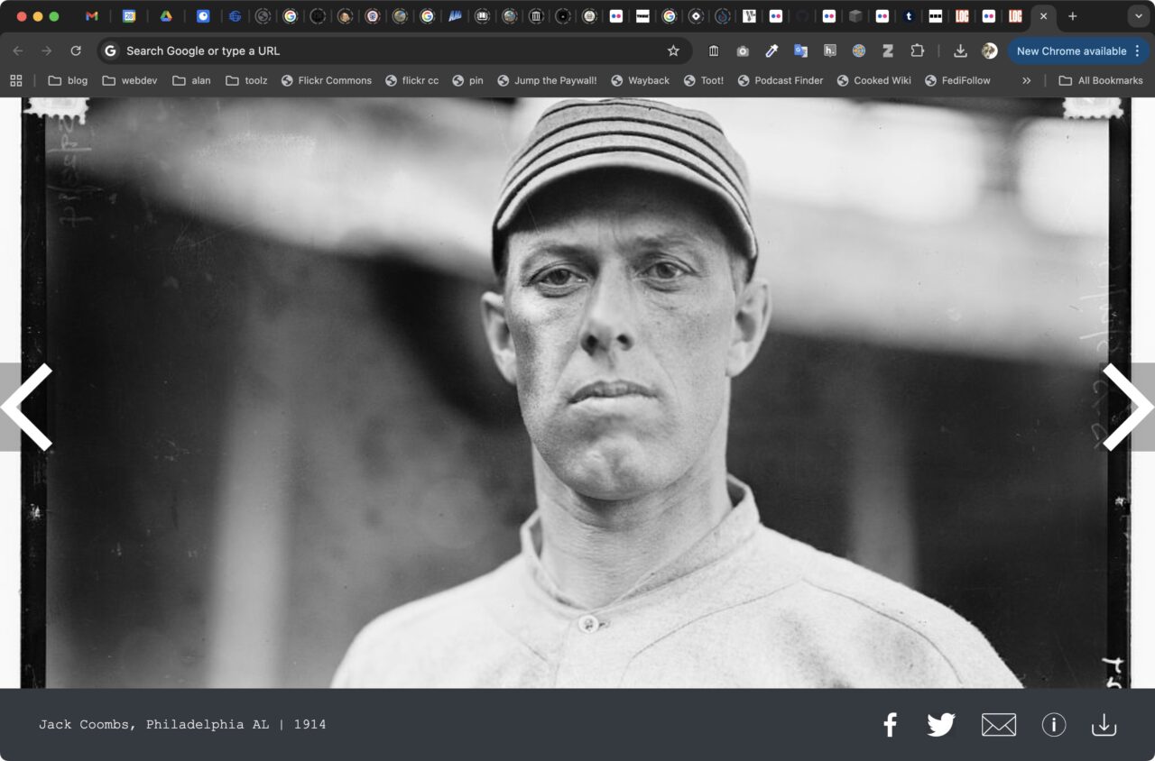 In a new web browser window closeup of the face of an early 1900s baseball player with a striped cap and a distance expression in his eyes.