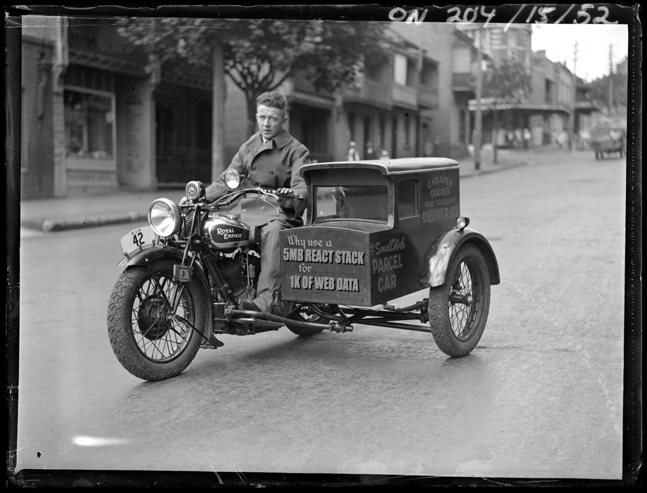 Vintage photo of a man driving a motorcycle with a side car attached, the front has been edited to read Why use a 5MB React Stack for 1k of web data. The side has been edited to read Smallweb Parcel Car.